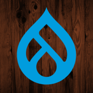 Drupal logo on dark wooden background
